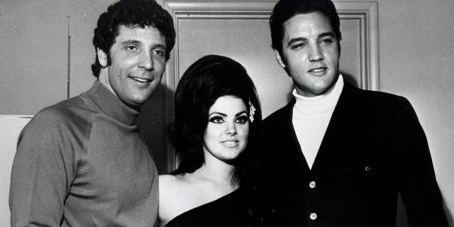  Elvis Presley (R) and Tom Jones pose for a portrait with Elvis' wife Priscilla Beaulieu Presley on April 7, 1968, in Las Vegas, Nevada. 