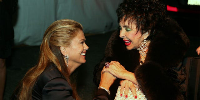 Kathy Ireland and actress Elizabeth Taylor at Macy's Passport Gala 2008 at Barker Hangar on September 25, 2008, in Santa Monica, California.