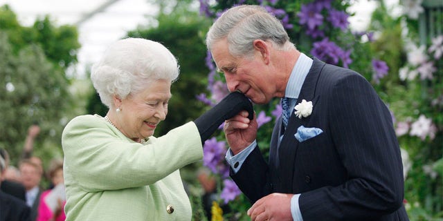 Queen Elizabeth II with her eldest son Prince Charles who is heir to the throne.