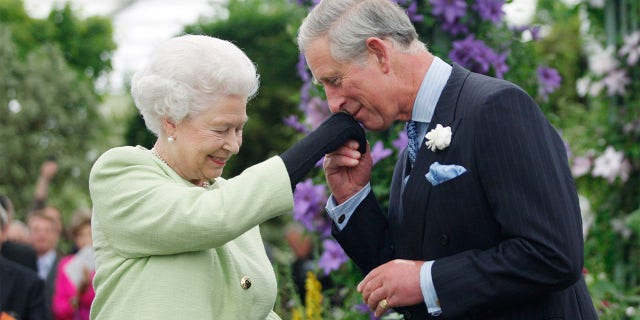 Queen Elizabeth II with her eldest son Prince Charles who is heir to the throne.