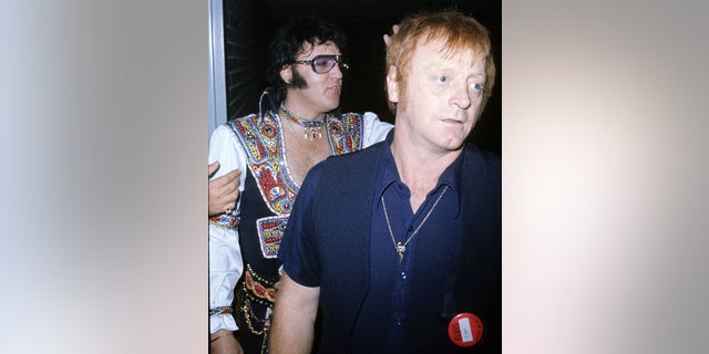 Elvis Presley with bodyguard Red West