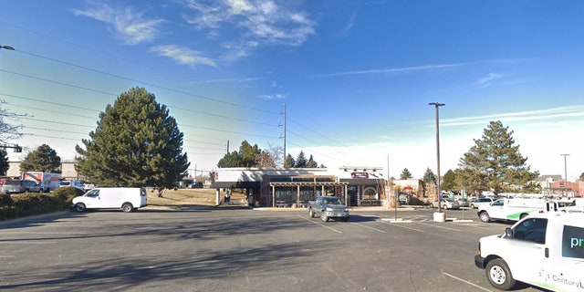 Investigators say the men robbed the woman at a Denver parking lot