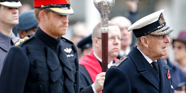 Prince Harry and Prince Philip, Duke of Edinburgh attend the opening of the Field of Remembrance at Westminster Abbey on November 10, 2016, in London, England. 