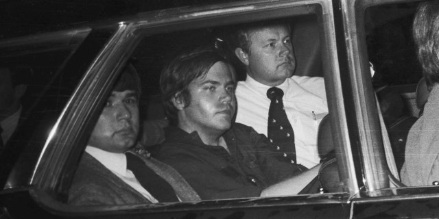 John Hinckley, Jr. (center) Getty