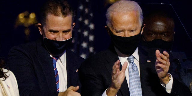Then-Democratic presidential nominee Joe Biden and his son Hunter celebrate onstage at his election night rally. Hunter has faced scrutiny for selling high-priced art despite no formal art experience. 
