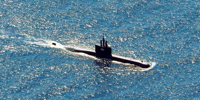 Indonesia's navy ships on Thursday were intensely searching for the submarine that likely fell too deep to retrieve, making survival chances for all the crew on board slim.