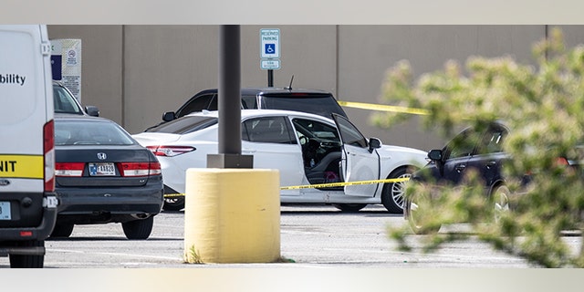 A vehicle with blood on the passenger side door sits vacant in the parking lot of a FedEx SmartPost on April 16, 2021 in Indianapolis, Indiana. (Jon Cherry/Getty Images)