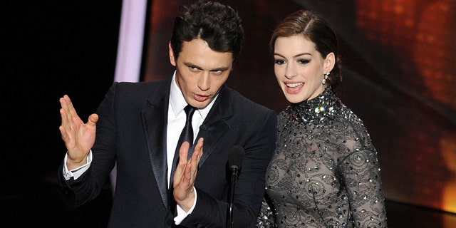 Actors James Franco, left, and Anne Hathaway present the 83rd Annual Academy Awards at the Kodak Theatre on February 27, 2011, in Hollywood, Calif. (Gabriel Bouys/AFP via Getty Images)