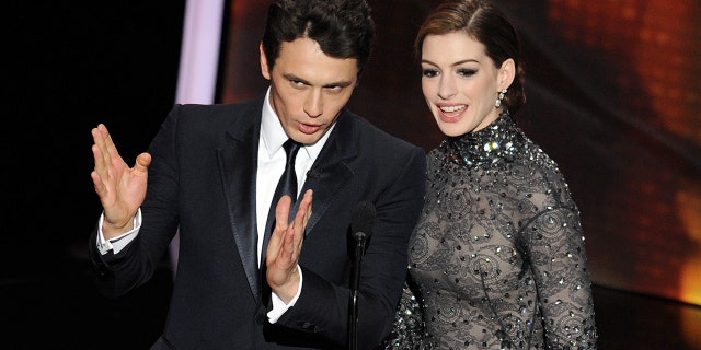Actors James Franco, left, and Anne Hathaway present the 83rd Annual Academy Awards at the Kodak Theater on February 27, 2011, in Hollywood, California (Gabriel Bouys / AFP via Getty Images).