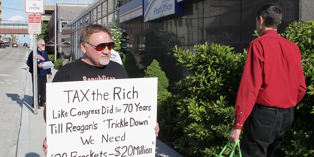 This 2012 file photo shows James Hodgkinson of Belleville protesting outside the United States Post Office in Downtown Belleville, Ill. 