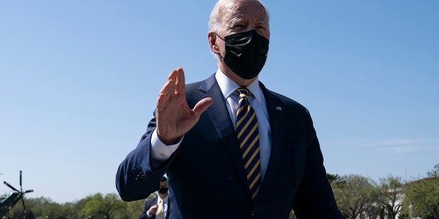 President Joe Biden talks with reporters on the Ellipse on the National Mall after spending the weekend at Camp David, Monday, April 5, 2021, in Washington. (AP Photo/Evan Vucci)