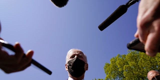 President Biden speaks to members of the media after arriving on the Ellipse on the National Mall after spending the weekend at Camp David, Monday, April 5, 2021, in Washington. (AP Photo/Evan Vucci)
