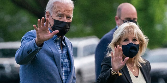 President Biden with first lady Jill Biden wave as they walk on the Ellipse near the White House after spending the weekend in Wilmington, Del., Sunday, April 25, 2021, in Washington.
