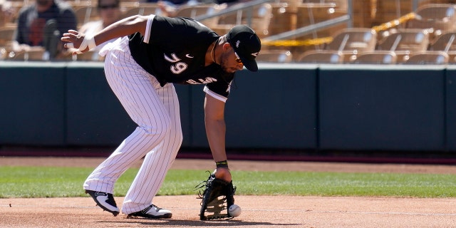 Chicago White Sox first baseman Jose Abreu fields a ground ball hit by San Francisco Giants' Jason Vosler during the second inning of a spring training baseball game Monday, March 22, 2021, in Phoenix. (AP Photo/Ross D. Franklin)