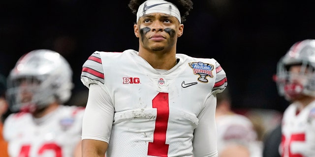 FILE -= Ohio State quarterback Justin Fields watches during the second half of the Sugar Bowl NCAA college football game against Clemson Friday, Jan. 1, 2021, in New Orleans. Fields is a likely first-round pick in the NFL Draft, April 29-May 1, 2021, in Cleveland.(AP Photo/John Bazemore, File)