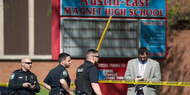 Law enforcement officers respond to a shooting at Austin-East Magnet High School in Knoxville, Tenn., Monday, April 12, 2021.