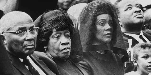 The parents and the widow of assassinated civil rights leader Dr. Martin Luther King Jr. listen to ceremonies at Morehouse College during a memorial for King shortly after his death, Atlanta, Georgia. L-R: Reverend Martin Luther King Sr., his wife Alberta King, Coretta Scott King, and King Jr.'s daughter Bernice. (Photo by New York Times Co./Getty Images)
