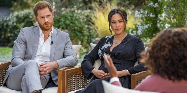 In this handout image provided by Harpo Productions and released on March 5, 2021, Oprah Winfrey interviews Prince Harry and Meghan Markle on A CBS Primetime Special premiering on CBS on March 7, 2021. (Photo by Harpo Productions/Joe Pugliese via Getty Images)