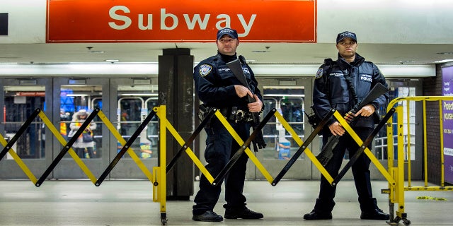 Police stand guard inside the Port Authority Bus Terminal on Dec. 11, 2017. (AP)