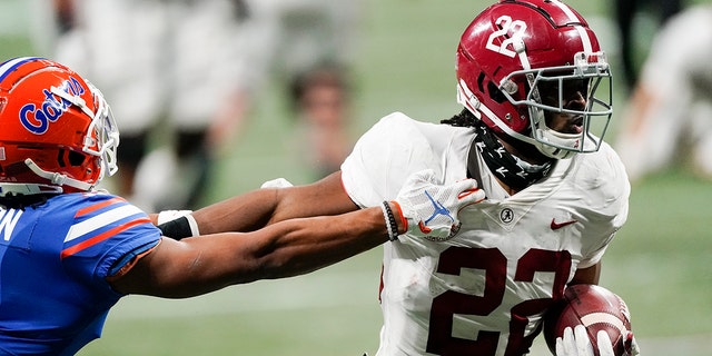 FILE - In this Saturday, Dec. 19, 2020 file photo, Alabama running back Najee Harris (22) runs into the end zone for a touchdown against Florida during the first half of the Southeastern Conference championship NCAA college football game in Atlanta. (AP Photo/John Bazemore, File)