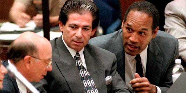 This May 3, 1995, file photo shows murder defendant O.J. Simpson, right, with friend Robert Kardashian, center, and Alvin Michelson, left, during a trial hearing in Los Angeles.