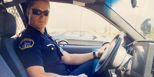 Officer Matthew Pavelka in his police cruiser.
