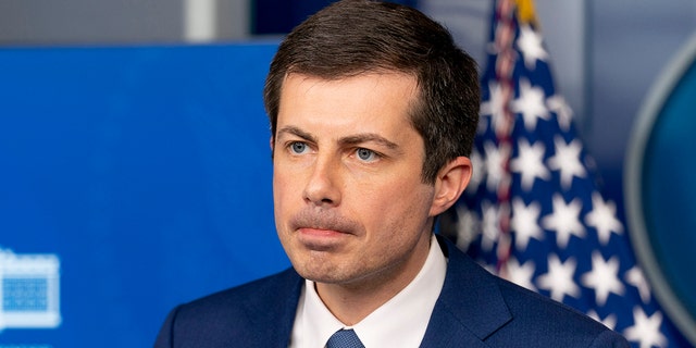 Transportation Secretary Pete Buttigieg takes a question from a reporter at a press briefing at the White House on April 9 in Washington.