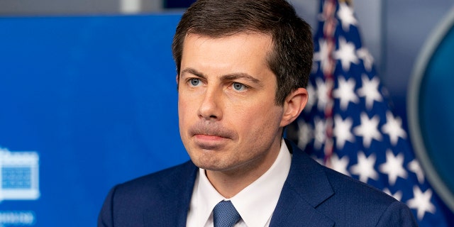 Transportation Secretary Pete Buttigieg takes a question from a reporter at a press briefing at the White House on April 9 in Washington.