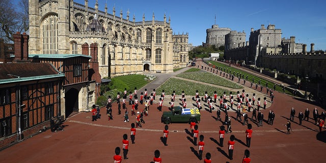 Members of the Royal family follow the coffin of Britain's Prince Philip during the funeral inside Windsor Castle.