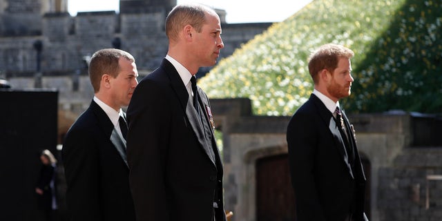 Harry has made solo trips to the U.K. to attend the funeral of his grandfather, Prince Philip, in April 2021. Here, Prince Harry, right, Prince William, Peter Phillips, left, follow the coffin in a ceremonial procession for the funeral of Britain's Prince Philip inside Windsor Castle in Windsor, England, April 17, 2021.