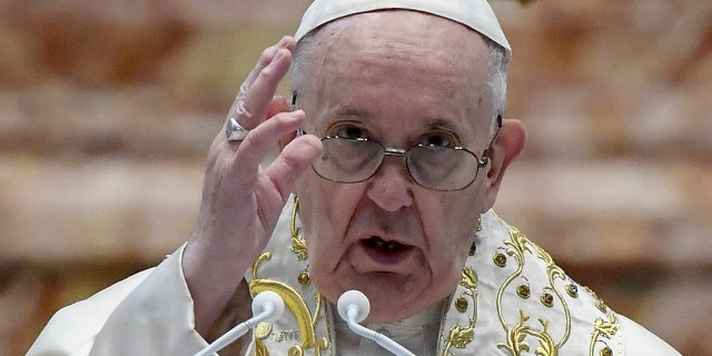 Pope Francis delivers his Urbi et Orbi blessing after celebrating Easter Mass at St. Peter's Basilica at The Vatican Sunday, April 4, 2021. (Filippo Monteforte/Pool photo via AP)