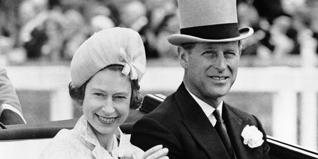 In this June 19, 1962 file photo, Britain's Prince Philip and his wife Queen Elizabeth II arrive at Royal Ascot race meeting, England. Buckingham Palace says Prince Philip, husband of Queen Elizabeth II, has died aged 99. Buckingham Palace says Prince Philip, husband of Queen Elizabeth II, has died aged 99. 