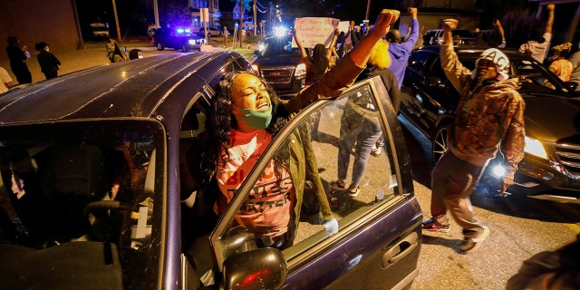 A motorist joins other protesters marching in the evening after family members were shown body camera footage of a deputy sheriff shooting and killing Black suspect Andrew Brown Jr. last week, in Elizabeth City, North Carolina, on April 26, 2021. REUTERS/Jonathan Drake