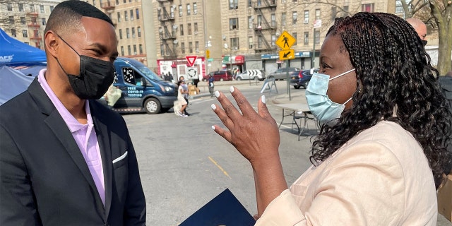 Rep. Ritchie Torres, D-N.Y. talks with a constituent in the Bronx.