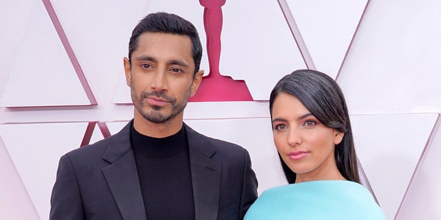 Actor Riz Ahmed and author Fatima Farheen Mirza married at some point over the last year and made their red carpet debut at the Academy Awards. (Photo by Chris Pizzello-Pool/Getty Images)