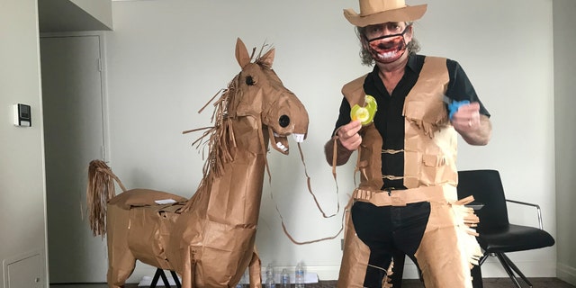 After creating his costume, Marriott went on to make himself a paper horse, which he named Russell. (David Marriott via AP)