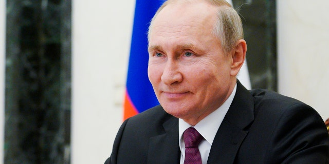 Russian President Vladimir Putin attends a meeting via video conference, at the Kremlin in Moscow, Russia, Thursday, March 25, 2021. (Alexei Druzhinin, Sputnik, Kremlin Pool Photo via AP)