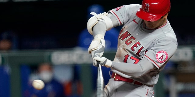 Los Angeles Angels designated hitter Shohei Ohtani smacks a two-run double against the Kansas City Royals in Kansas City, Mo., Monday, April 12, 2021. (Associated Press)