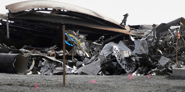 Debris is recovered from a National Wildlife Refuge after uncrewed SpaceX Starship prototype rocket SN11 failed to land safely, in Boca Chica, Texas, U.S. March 31,2021. REUTERS/Gene Blevins