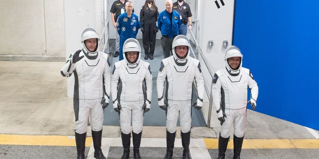 From left to right, ESA (European Space Agency) astronaut Thomas Pesquet, NASA astronauts Megan McArthur and Shane Kimbrough, and Japan Aerospace Exploration Agency (JAXA) astronaut Akihiko Hoshide, wearing SpaceX spacesuits, are seen as they prepare to depart the Neil A. Armstrong Operations and Checkout Building for Launch Complex 39A during a dress rehearsal prior to the Crew-2 mission launch, Sunday, April 18, 2021, at NASA’s Kennedy Space Center in Florida. Photo Credit: (NASA/Aubrey Gemignani)