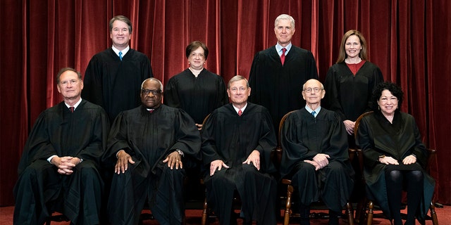 Members of the Supreme Court pose for a group photo at the Supreme Court in Washington, Friday, April 23, 2021. Seated from left are Associate Justice Samuel Alito, Associate Justice Clarence Thomas, Chief Justice John Roberts, Associate Justice Stephen Breyer and Associate Justice Sonia Sotomayor, Standing from left are Associate Justice Brett Kavanaugh, Associate Justice Elena Kagan, Associate Justice Neil Gorsuch and Associate Justice Amy Coney Barrett. (Erin Schaff/The New York Times via AP, Pool)