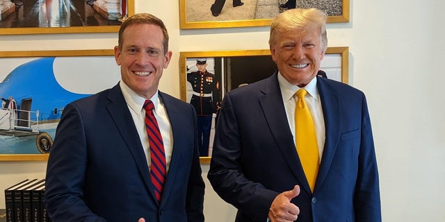 Republican Rep. Ted Budd of North Carolina meets with former President Donald Trump after holding a fundraiser for his burgeoning 2022 Senate campaign at Trump's Mar-a-Lago club in Palm Beach, Florida on Friday, April 23, 2021.
