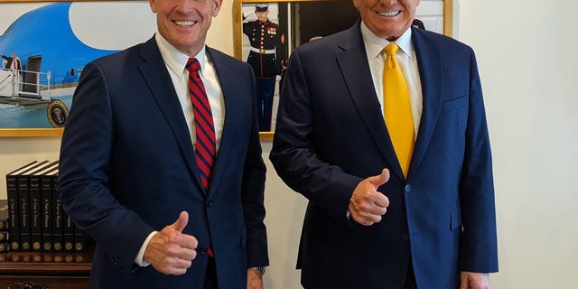 Republican Rep. Ted Budd of North Carolina meets with former President Donald Trump after holding a fundraiser for his burgeoning 2022 Senate campaign at Trump's Mar-a-Lago club in Palm Beach, Florida on Friday, April 23, 2021.