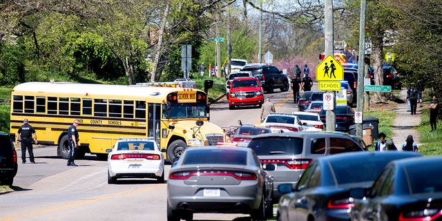 Police attend a shooting at Austin-East Magnet High School in Knoxville, Tennessee, U.S. April 12, 2021. 