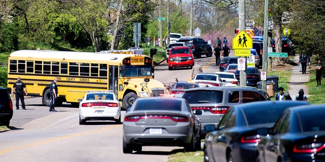 Police attend a shooting at Austin-East Magnet High School in Knoxville, Tennessee, U.S. April 12, 2021.