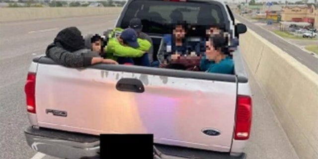 U.S. Customs and Border Protection agents took migrants found in a pickup truck into custody this week. 