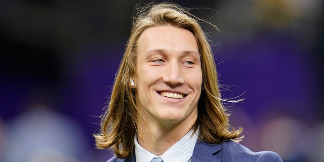 FILE - Clemson quarterback Trevor Lawrence arrives before the NCAA College Football Playoff national championship game against LSU in New Orleans, in this Monday, Jan. 13, 2020, file photo. Lawrence is a likely top pick in the NFL Draft, April 29-May 1, 2021, in Cleveland. (AP Photo/David J. Phillip, File)