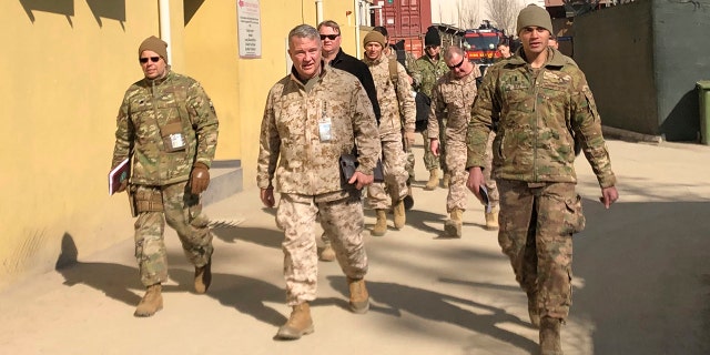 FILE - In this Jan. 31, 2020, file photo Marine Gen. Frank McKenzie, center, top U.S. commander for the Middle East, makes an unannounced visit in Kabul, Afghanistan. (AP Photos/Lolita Baldor, File)