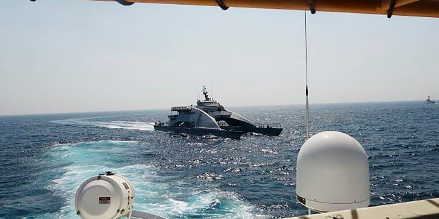 The U.S. Coast Guard ship USCGC Wrangell is photographed here being targeted in the Persian Gulf by the same Iranian vessel on April 2. (AP/U.S. Navy)