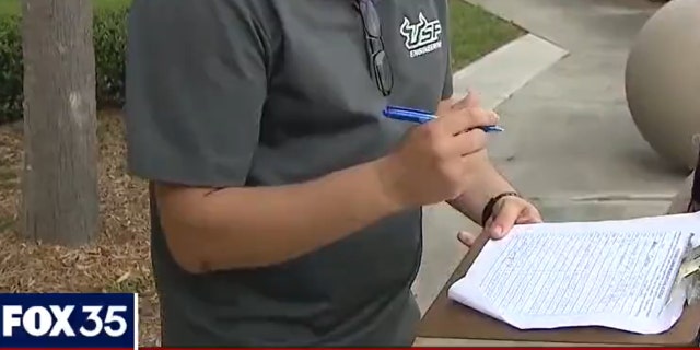 Man signs petition to make masks optional in schools (Credit: Fox 35 Orlando)